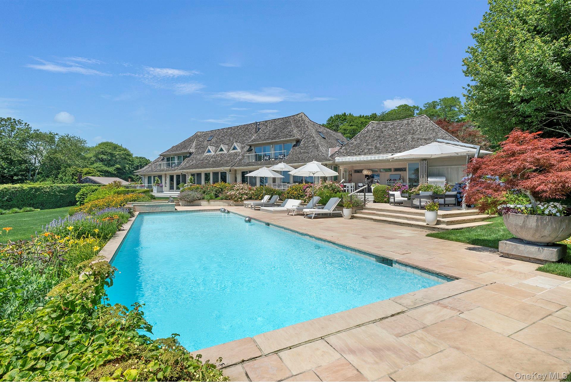 316 Deerfield Road Water Mill, NY 11976 - Photo 12 of 22 a swimming pool with outdoor seating and yard