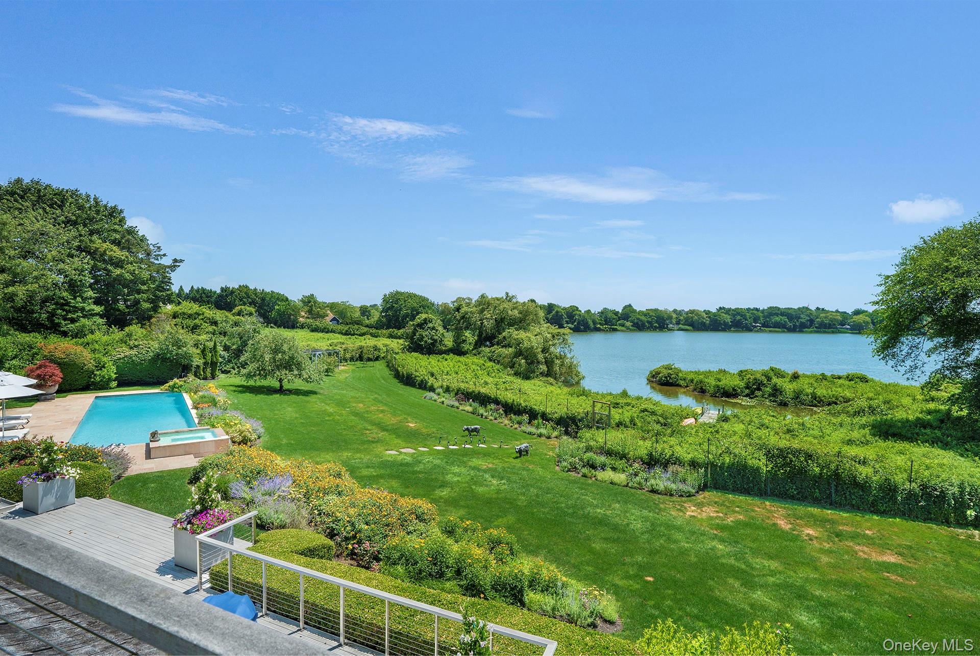 316 Deerfield Road Water Mill, NY 11976 - Photo 13 of 22 a view of a lake with a yard