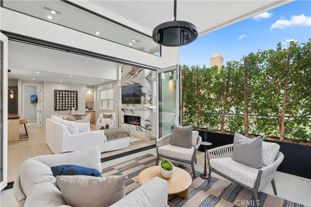 a living room with fireplace furniture and a flat screen tv