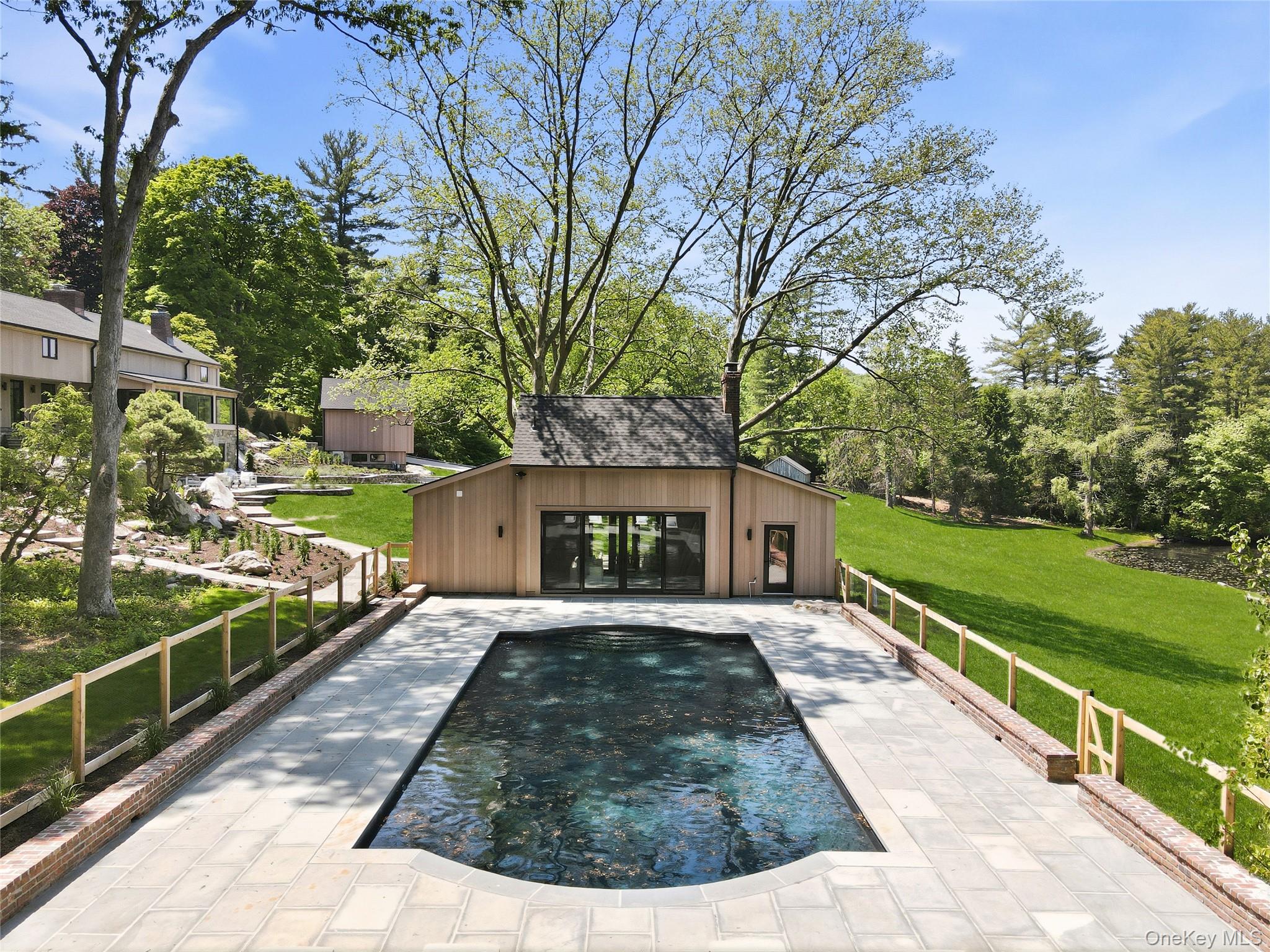 39 Old Snake Hill Road Pound Ridge, NY 10576 - Photo 22 of 37 a view of a backyard with a garden