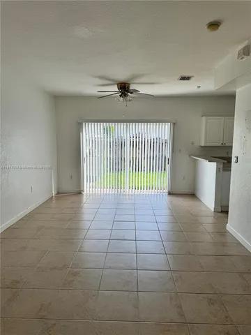 a view of a livingroom with a staircase