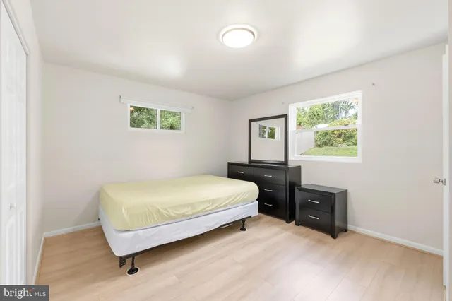 a bedroom with a bed and a table