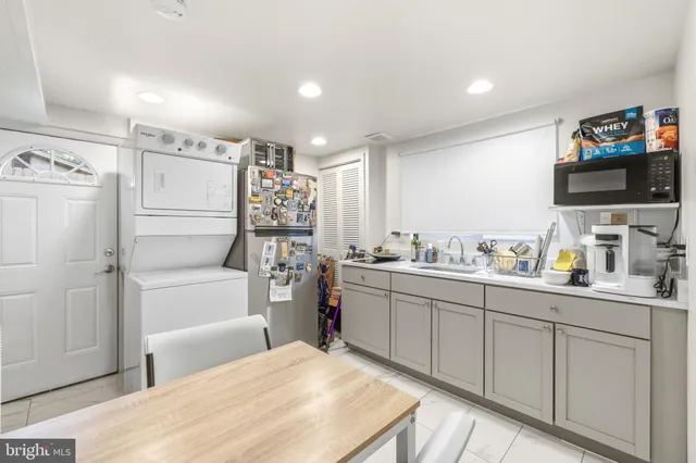 a bathroom with a sink vanity mirror and toilet