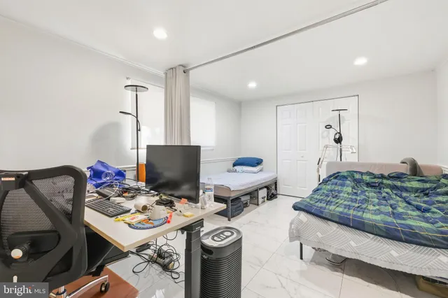 a bedroom with a bed and a table in it