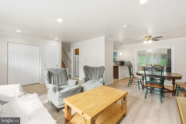 a living room with furniture a rug and a table