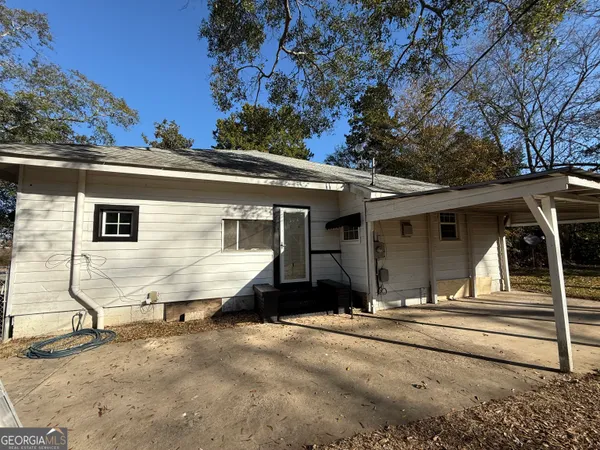 a house with trees in the background