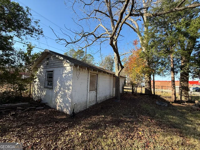 a house with trees in the background