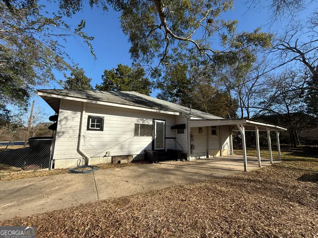 a backyard of a house with lots of green space