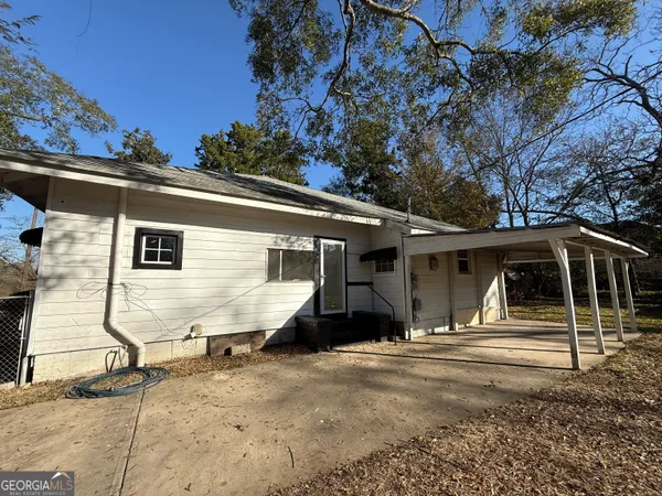a view of an empty room with wooden walls
