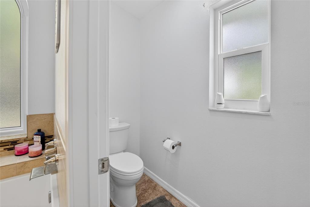 1668 Allens Ridge Drive North Palm Harbor, FL 34683 - Photo 24 of 48 a bathroom with a toilet and a sink