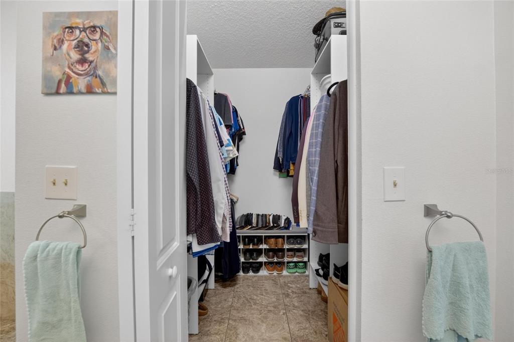 1668 Allens Ridge Drive North Palm Harbor, FL 34683 - Photo 25 of 48 a view of walk in closet with clothes and shoes