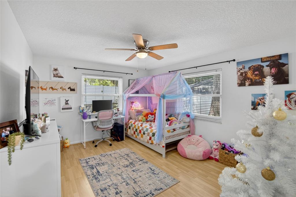 1668 Allens Ridge Drive North Palm Harbor, FL 34683 - Photo 30 of 48 a bedroom with furniture and a window