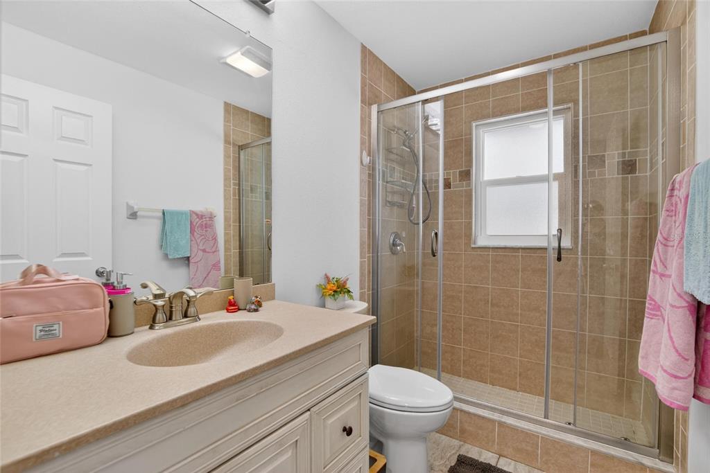 1668 Allens Ridge Drive North Palm Harbor, FL 34683 - Photo 32 of 48 a bathroom with a sink toilet and shower