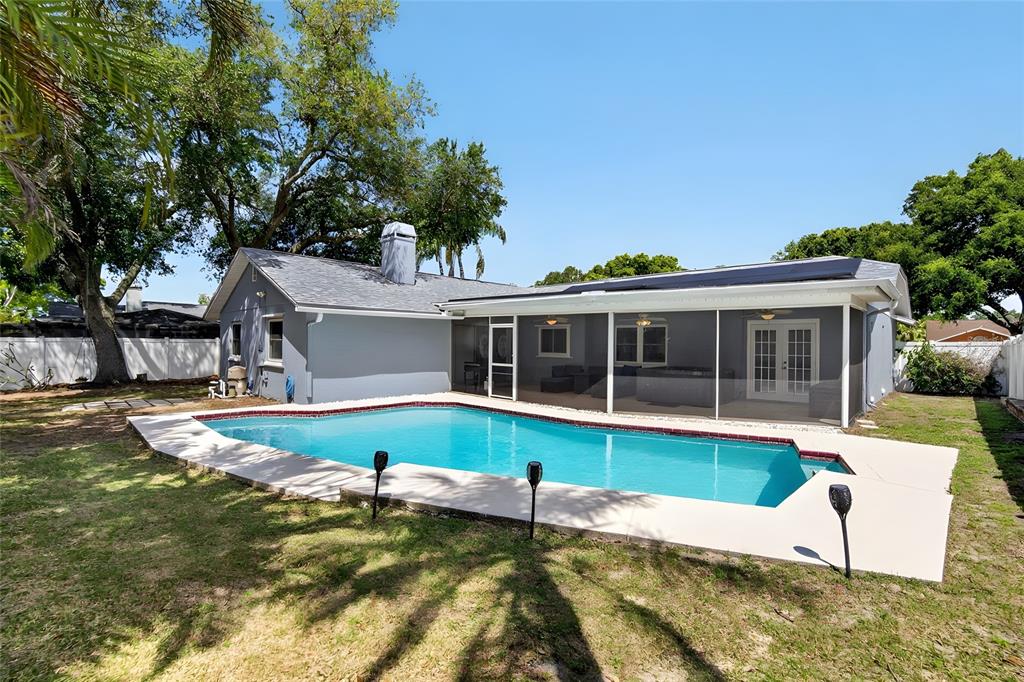 1668 Allens Ridge Drive North Palm Harbor, FL 34683 - Photo 38 of 48 a view of a house with swimming pool and sitting area