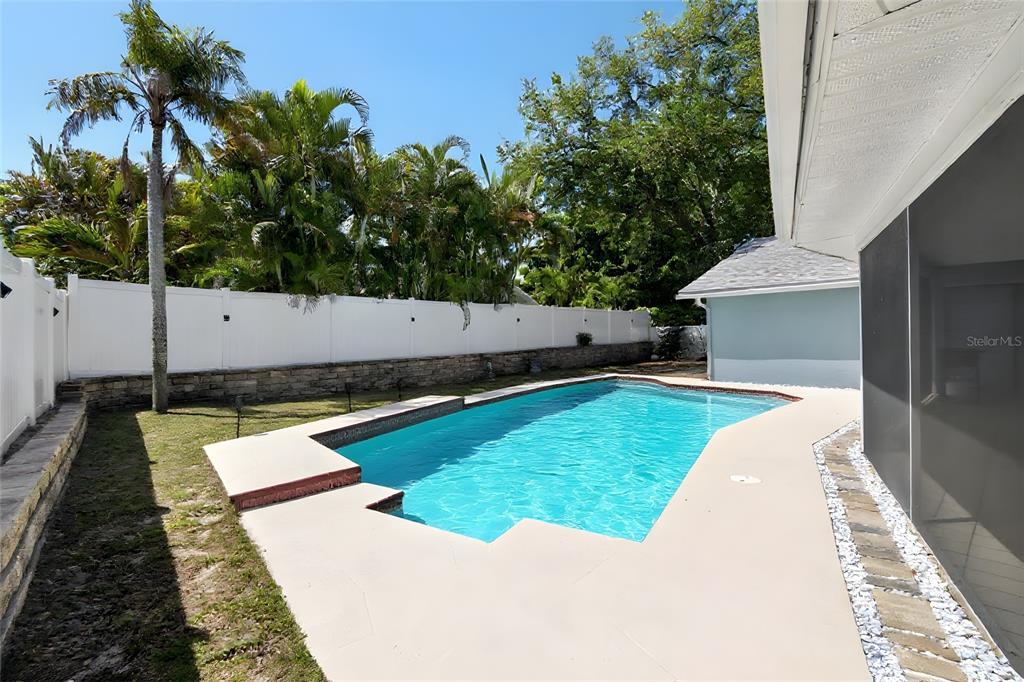 1668 Allens Ridge Drive North Palm Harbor, FL 34683 - Photo 39 of 48 swimming pool view with a seating space