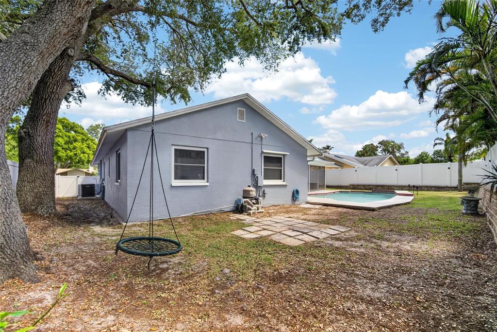 1668 Allens Ridge Drive North Palm Harbor, FL 34683 - Photo 40 of 48 a view of a backyard with a tree