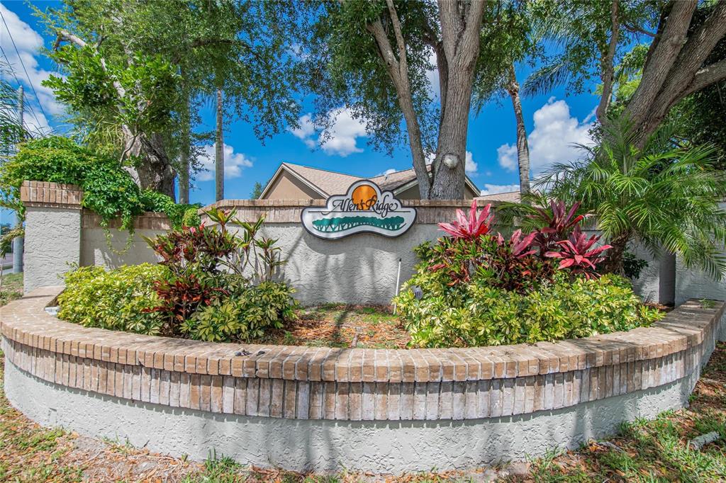 1668 Allens Ridge Drive North Palm Harbor, FL 34683 - Photo 47 of 48 front view of a house with a yard and potted plants