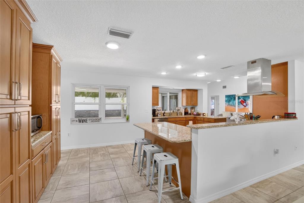 1668 Allens Ridge Drive North Palm Harbor, FL 34683 - Photo 8 of 48 a kitchen with stainless steel appliances granite countertop a sink and a refrigerator