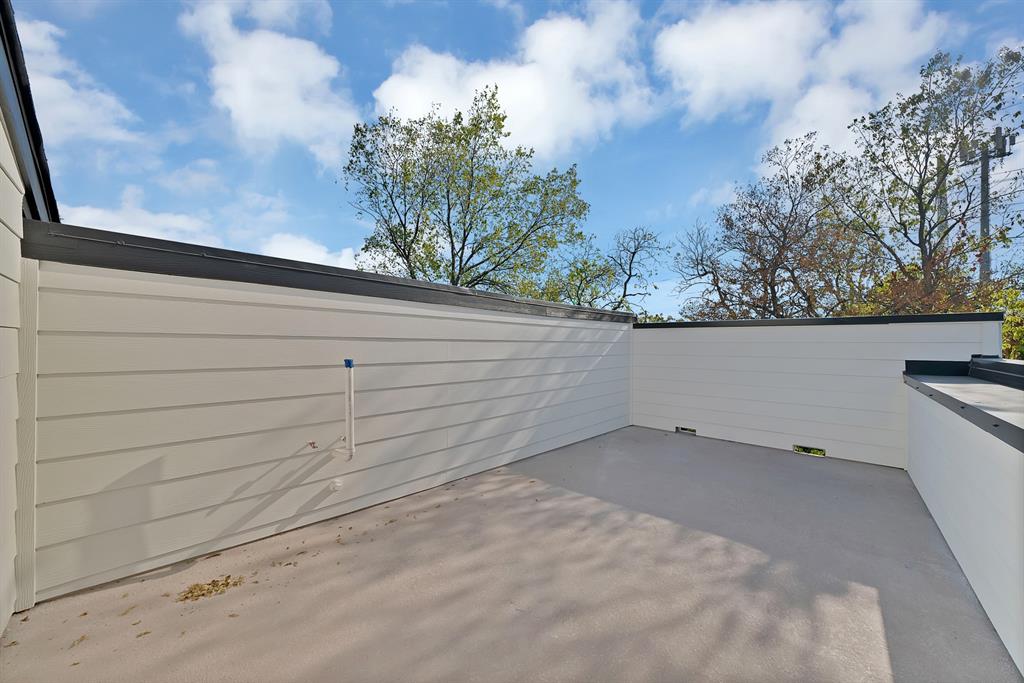 1415 Fayette Street Dallas, TX 75203 - Photo 6 of 40 Outdoor patio space featuring smooth concrete flooring and horizontal panel siding