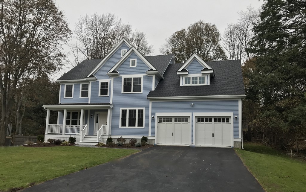 88 Bridge Street Lexington, MA 02421 - Photo 1 of 30 a front view of a house with a garden