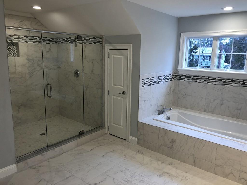 88 Bridge Street Lexington, MA 02421 - Photo 17 of 30 a bathroom with a bathtub and a shower