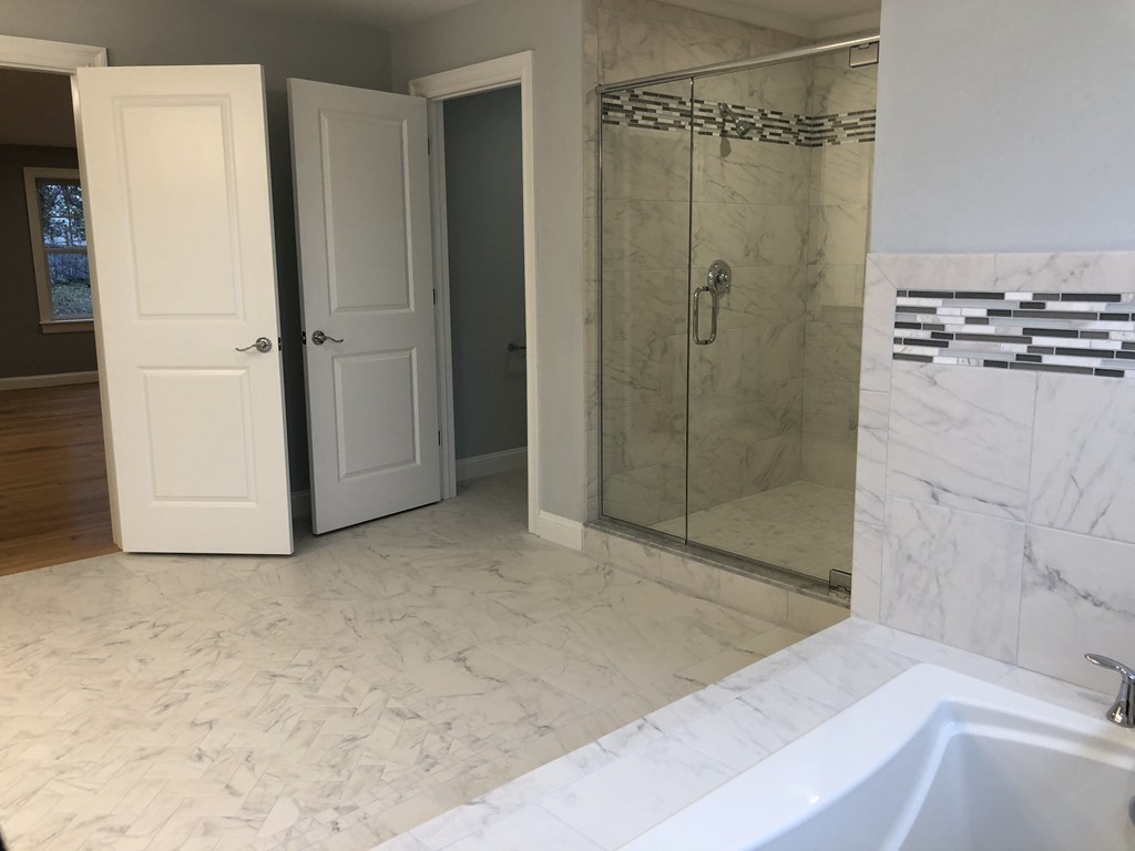 88 Bridge Street Lexington, MA 02421 - Photo 18 of 30 a bathroom with a shower and a bath tub