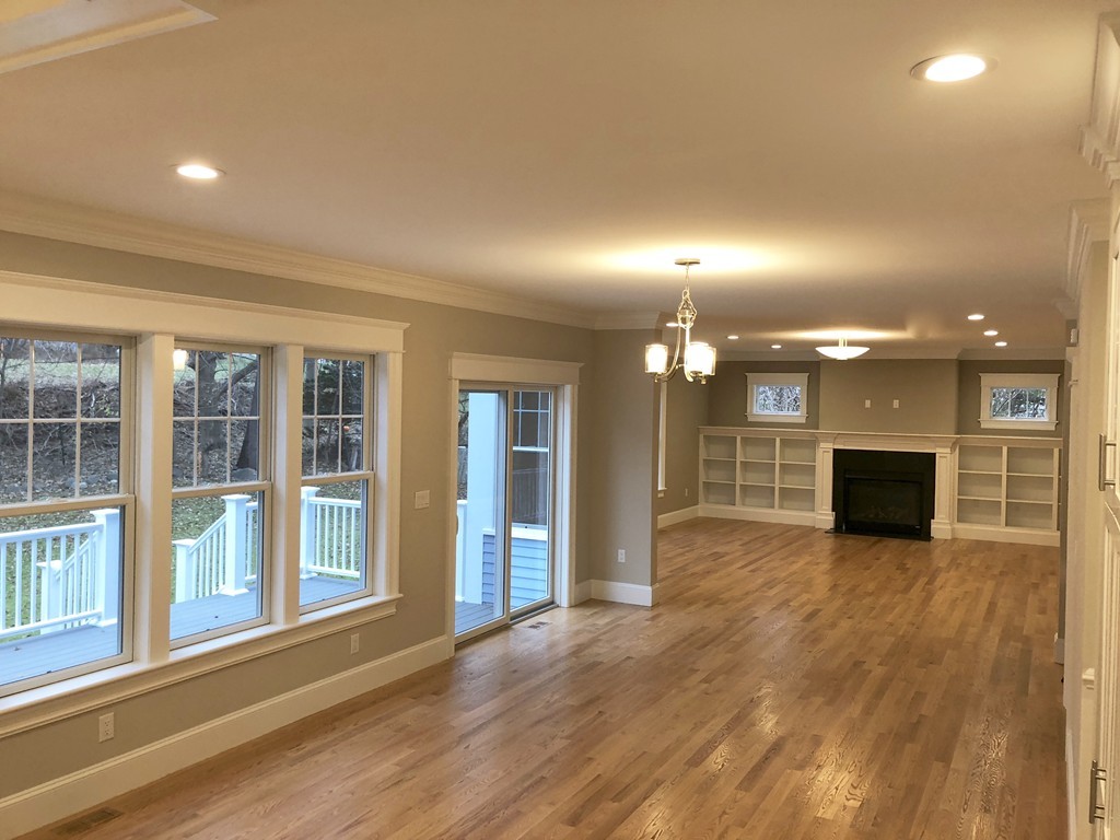 88 Bridge Street Lexington, MA 02421 - Photo 4 of 30 a view of a kitchen with a sink and a fireplace
