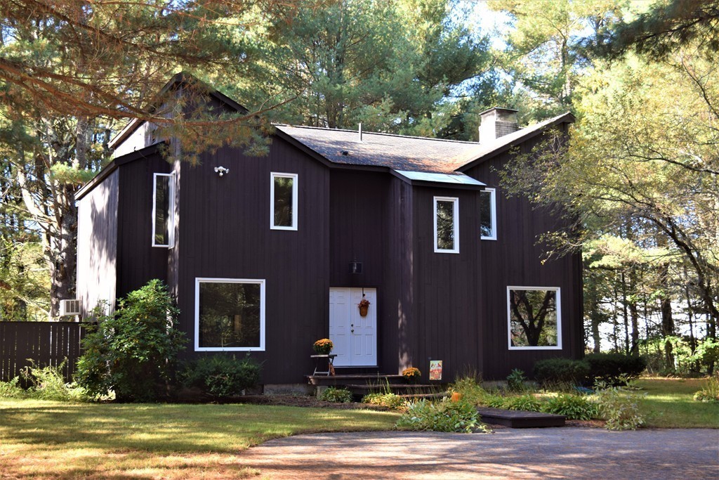 641 Wheelwright Road Barre, MA 01005 - Photo 1 of 26 a front view of a house with a yard garage and outdoor seating