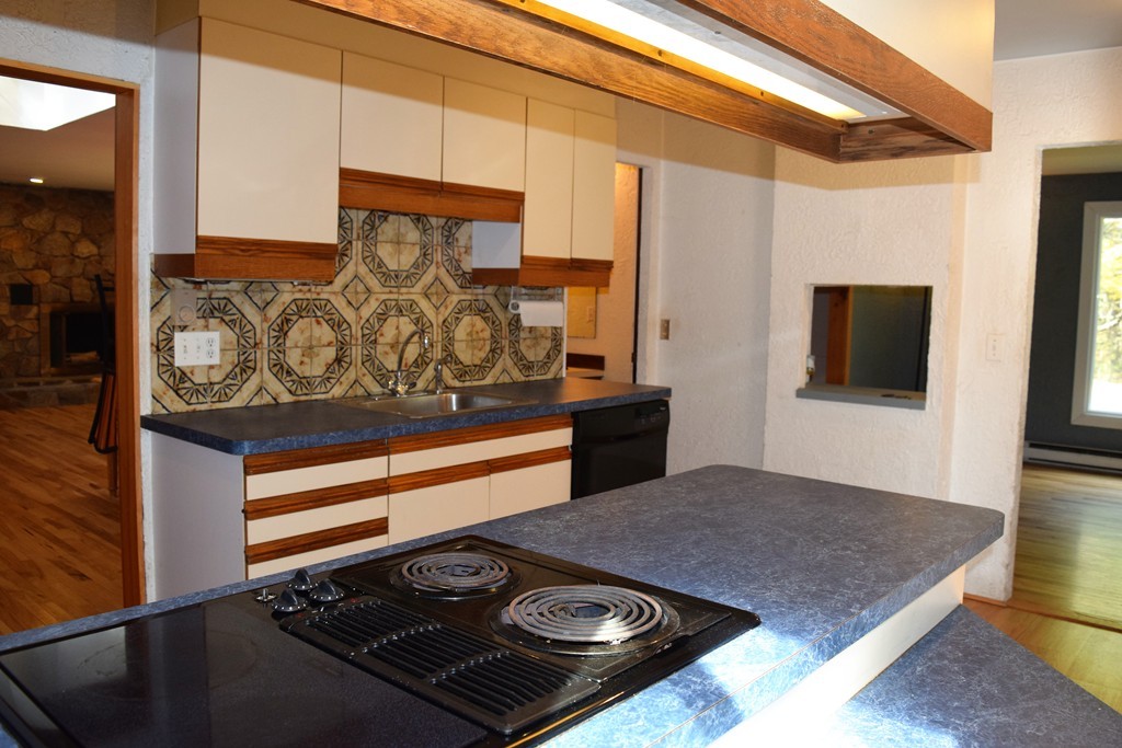 641 Wheelwright Road Barre, MA 01005 - Photo 11 of 26 a kitchen with a stove and a cabinet