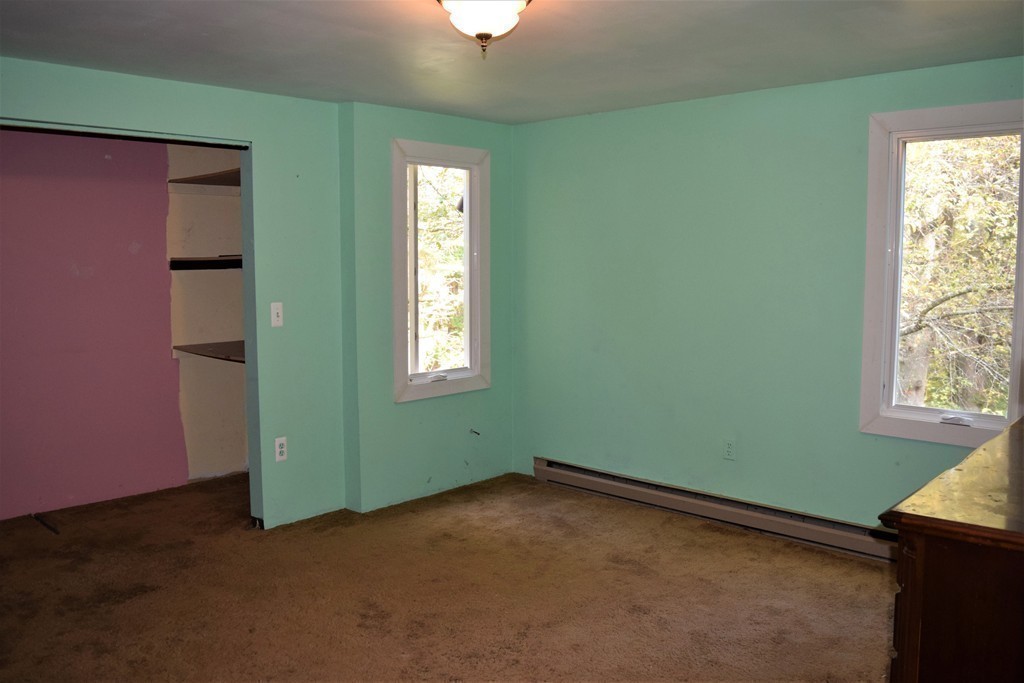 641 Wheelwright Road Barre, MA 01005 - Photo 17 of 26 an empty room with windows and closet