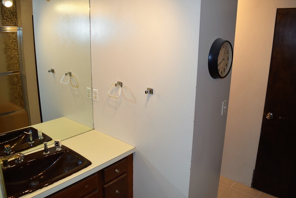 641 Wheelwright Road Barre, MA 01005 - Photo 18 of 26 a bathroom with a granite countertop sink and a mirror
