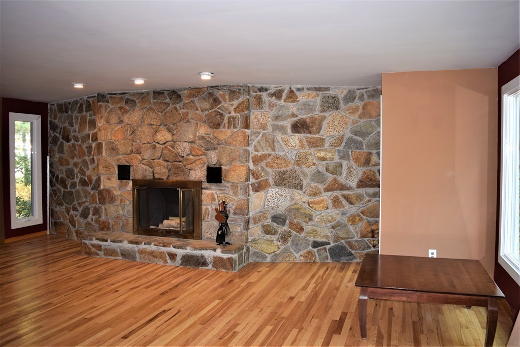 641 Wheelwright Road Barre, MA 01005 - Photo 5 of 26 a living room with a fireplace