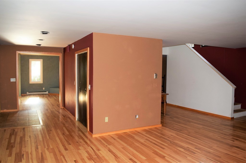 641 Wheelwright Road Barre, MA 01005 - Photo 6 of 26 a view of a livingroom with wooden floor