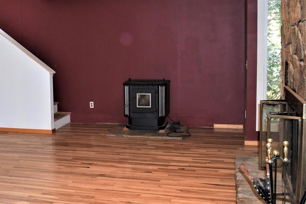 641 Wheelwright Road Barre, MA 01005 - Photo 7 of 26 a view of a livingroom with wooden floor and closet