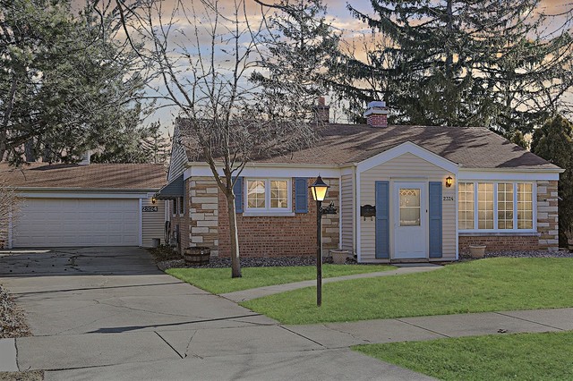 2324 Hawthorne Road Homewood, IL 60430 - Photo 1 of 10 a front view of a house with a garden