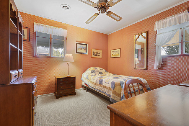 2324 Hawthorne Road Homewood, IL 60430 - Photo 5 of 10 a bedroom with two beds and a chandelier