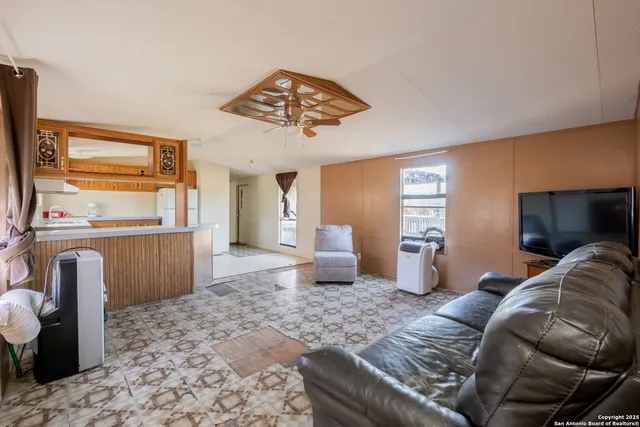 a bedroom with a bed and a television