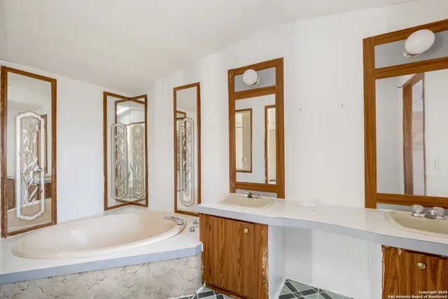 a bathroom with a glass shower door
