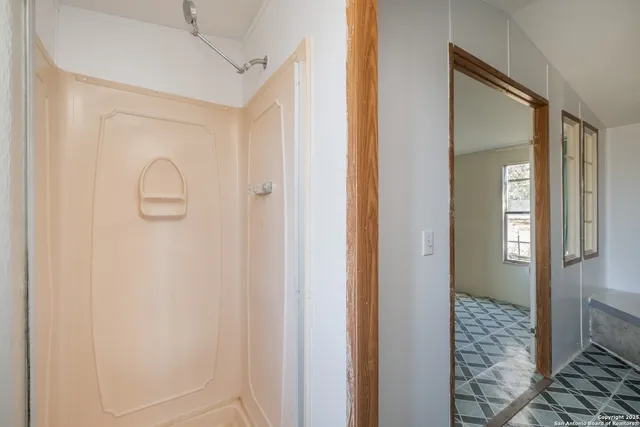 a bathroom with a sink a toilet and mirror