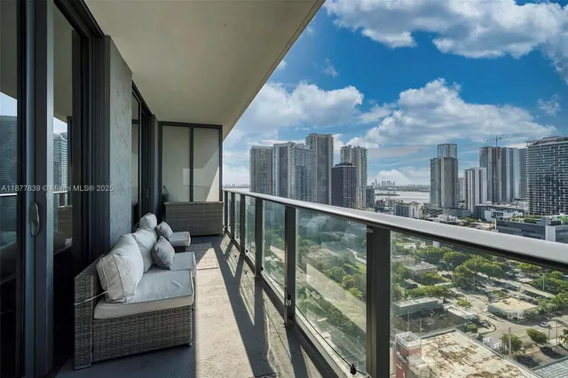 a view of a balcony with furniture