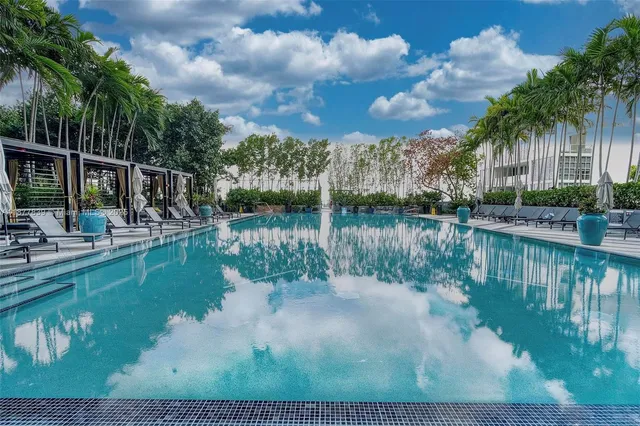 a view of swimming pool from a lake