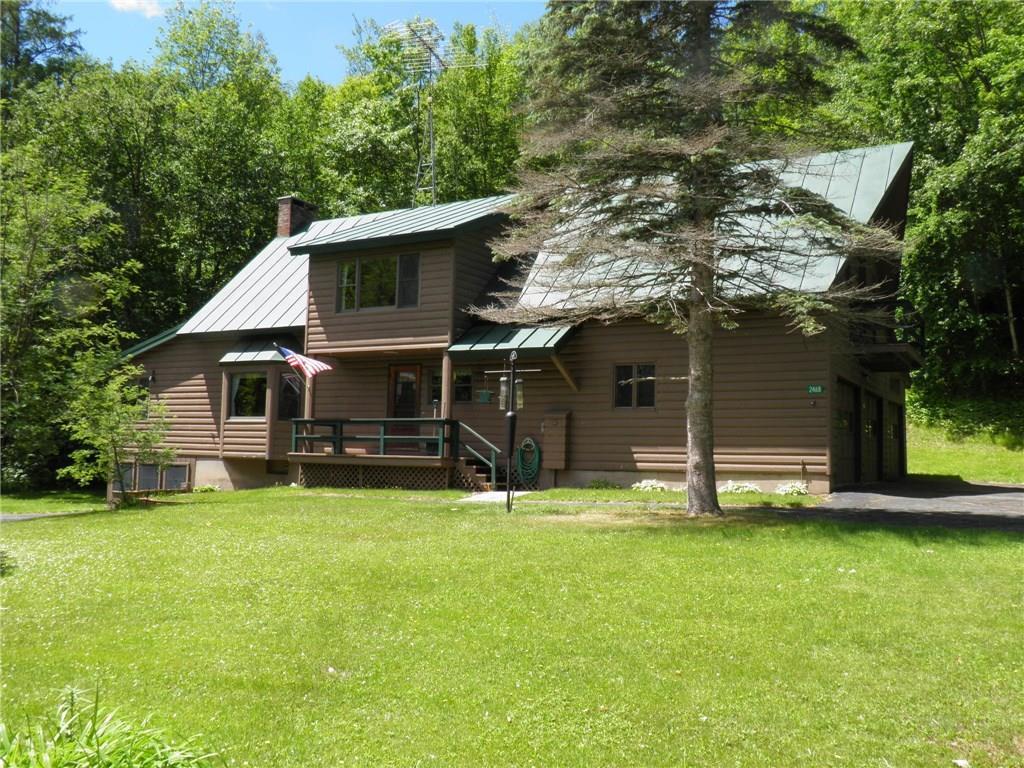 2468 Rangeley Road Phillips, ME 04966 - Photo 1 of 36 The house with the garage to the left.