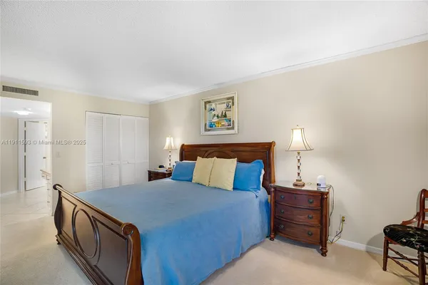 a bedroom with a bed and a lamp with window