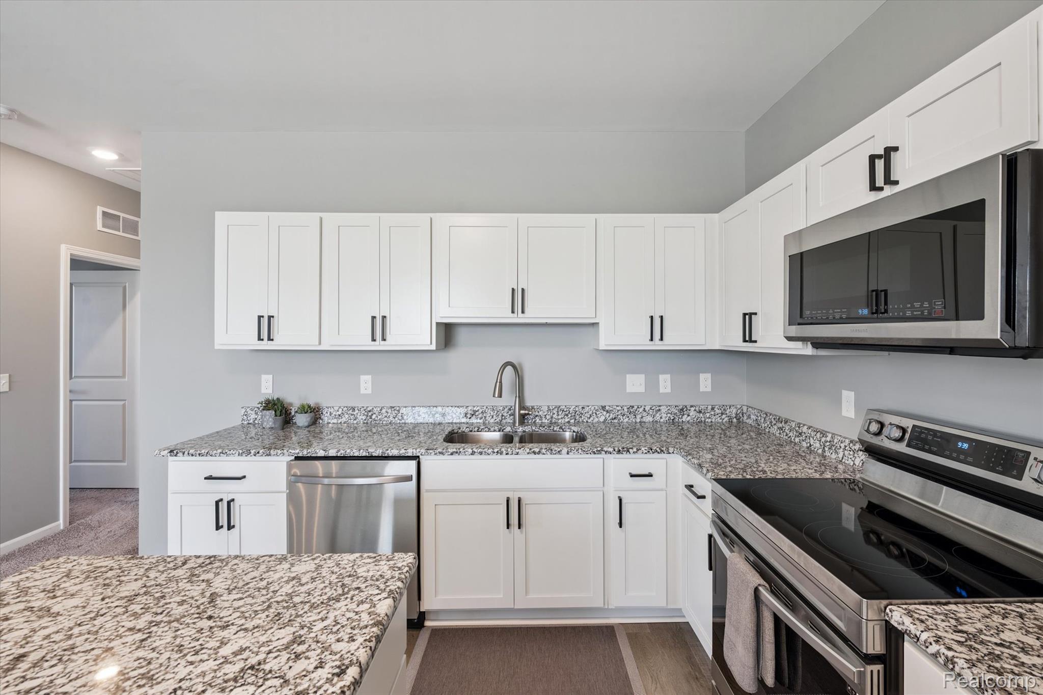 9930 Ridge Run Street Howell, MI 48855 - Photo 5 of 19 Plenty of space for cooking prep in this spacious kitchen.