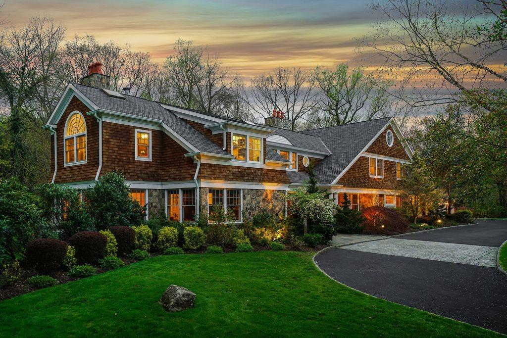 a front view of house with yard and green space