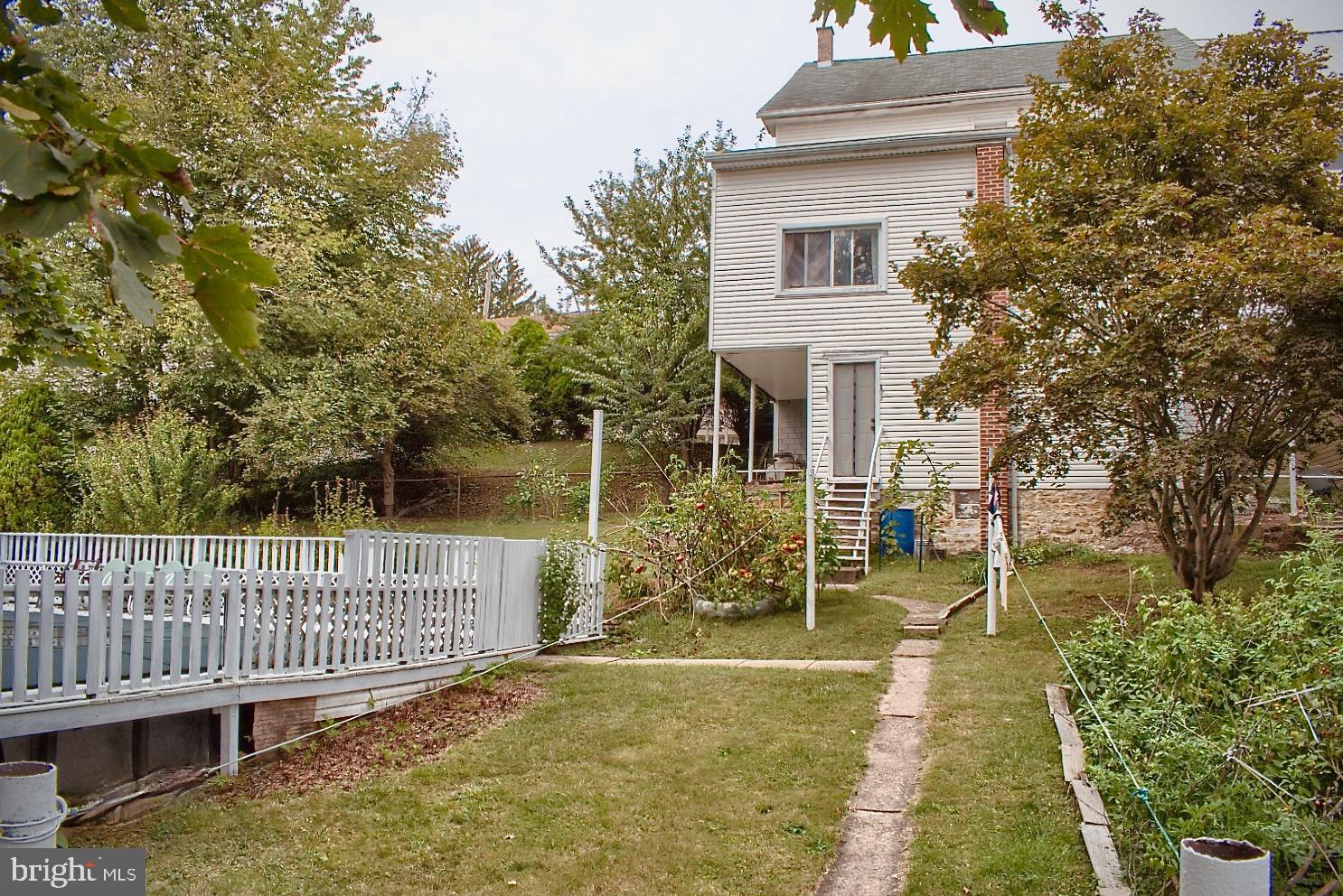 Charming home with lush garden retreat.