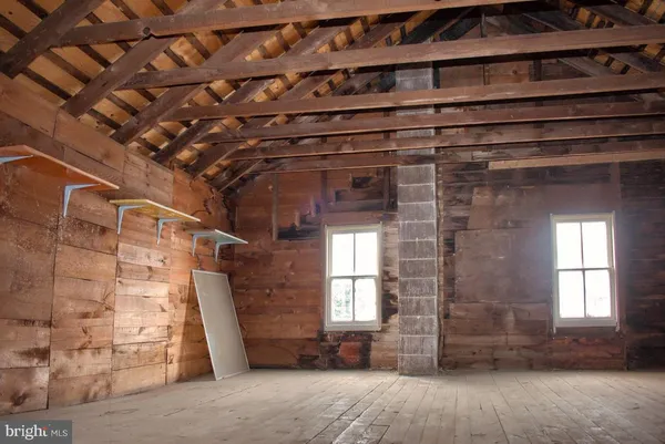 a bed room with a bed and a window