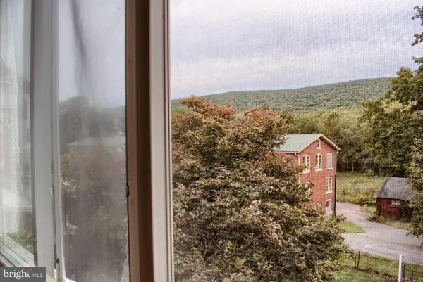 a room with gym equipment and a window