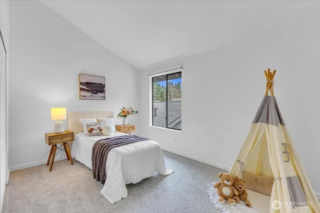 a bed room with a bed and a window