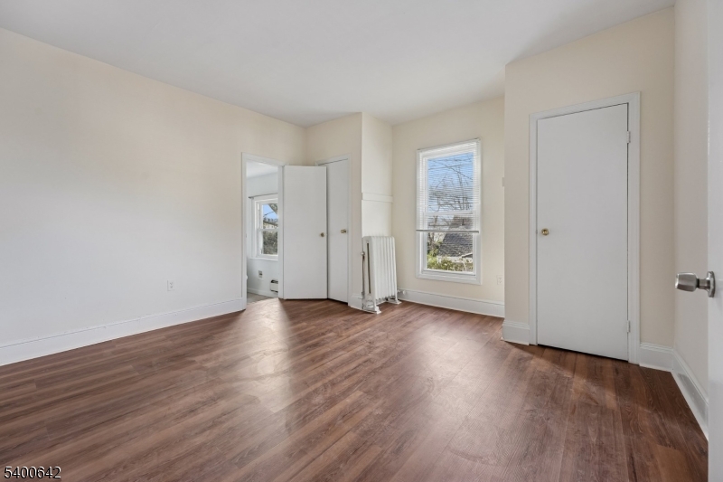 24 Franklin Place Summit, NJ 07901 - Photo 12 of 36 an empty room with wooden floor & windows